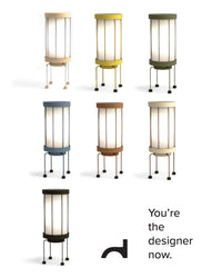 Set of colorful cylindrical lamps on a white background with text 'You're the designer now.'