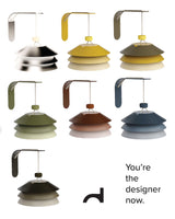 Set of colorful hanging lamps with a text prompt to 'You're the designer now.'