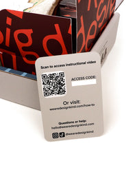 Card with QR code and text for accessing an instructional video and website.