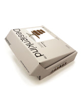 Designkind product packaging on a white background