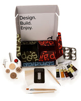 Design kit with various tools and materials on a white background